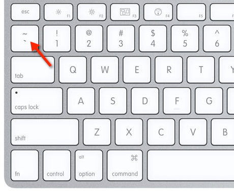 Map of Mac keyboard, arrow pointing toward back tick key, to the left of the 1 key.